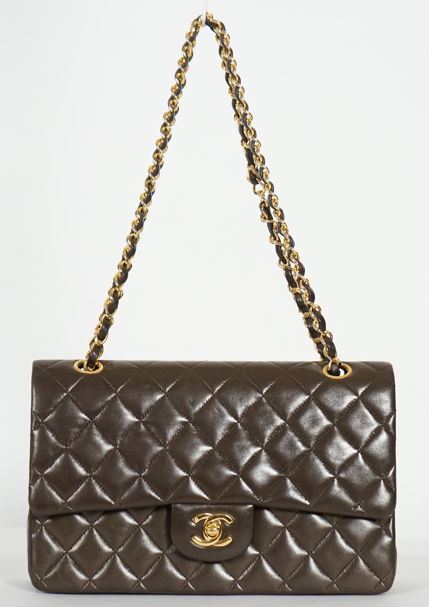 A Chanel brown quilted lambskin medium Classic Double Flap bag, width 25.5cm, height 15.5cm, depth 7cm